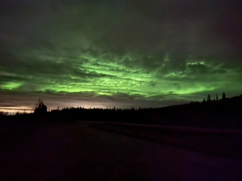 Aurora over snowy landscape